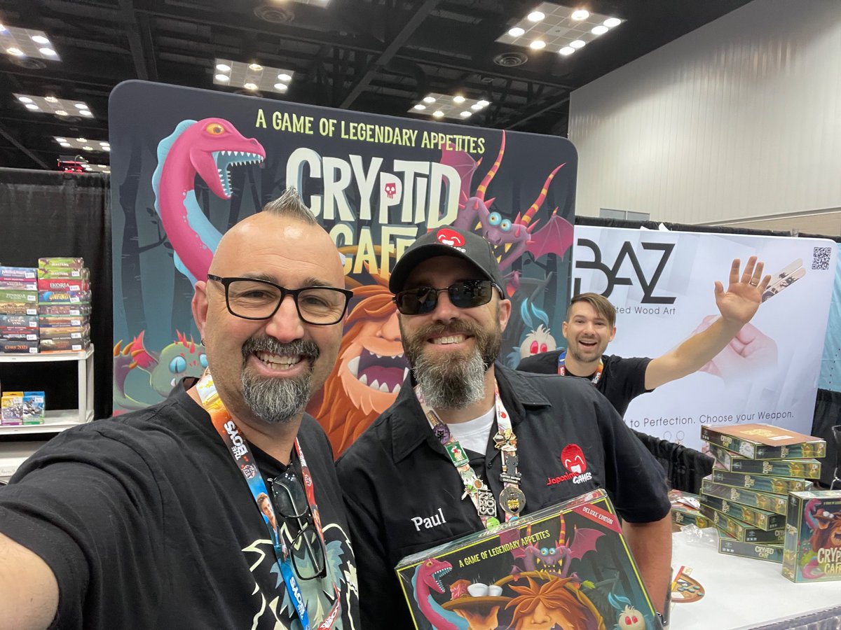 SquatchyGames's tweet photo. Traditional first customer of the con! Crazy busy and some new squatchers working the booth (1456). Swing by, say hi! #gencon https://t.co/8vrpCJaBZZ