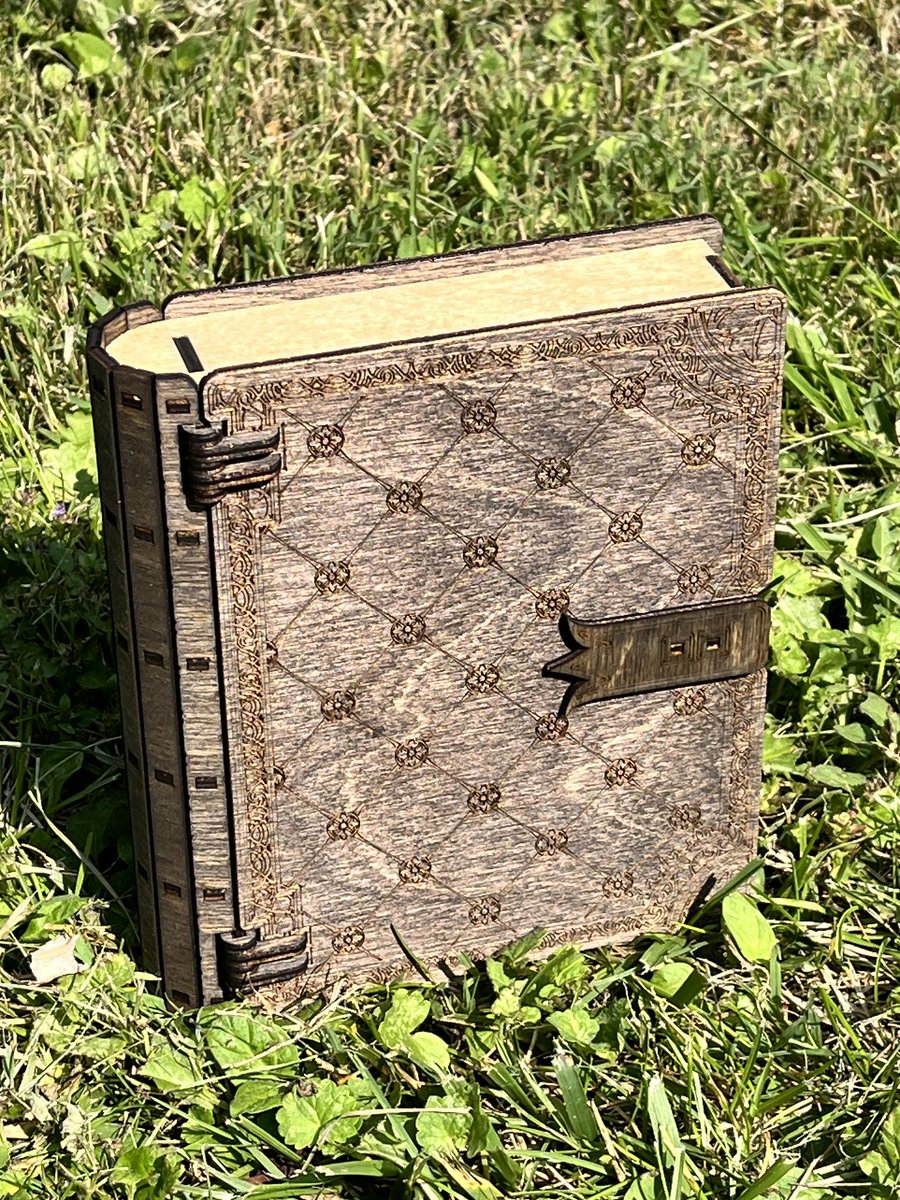 ThunderstruckWS's tweet photo. What secrets are hidden in this tome?  #dnd #ttrpg #tabletopgaming #MagicTheGathering #rpg #lasercut https://t.co/WL8XkmqXRk