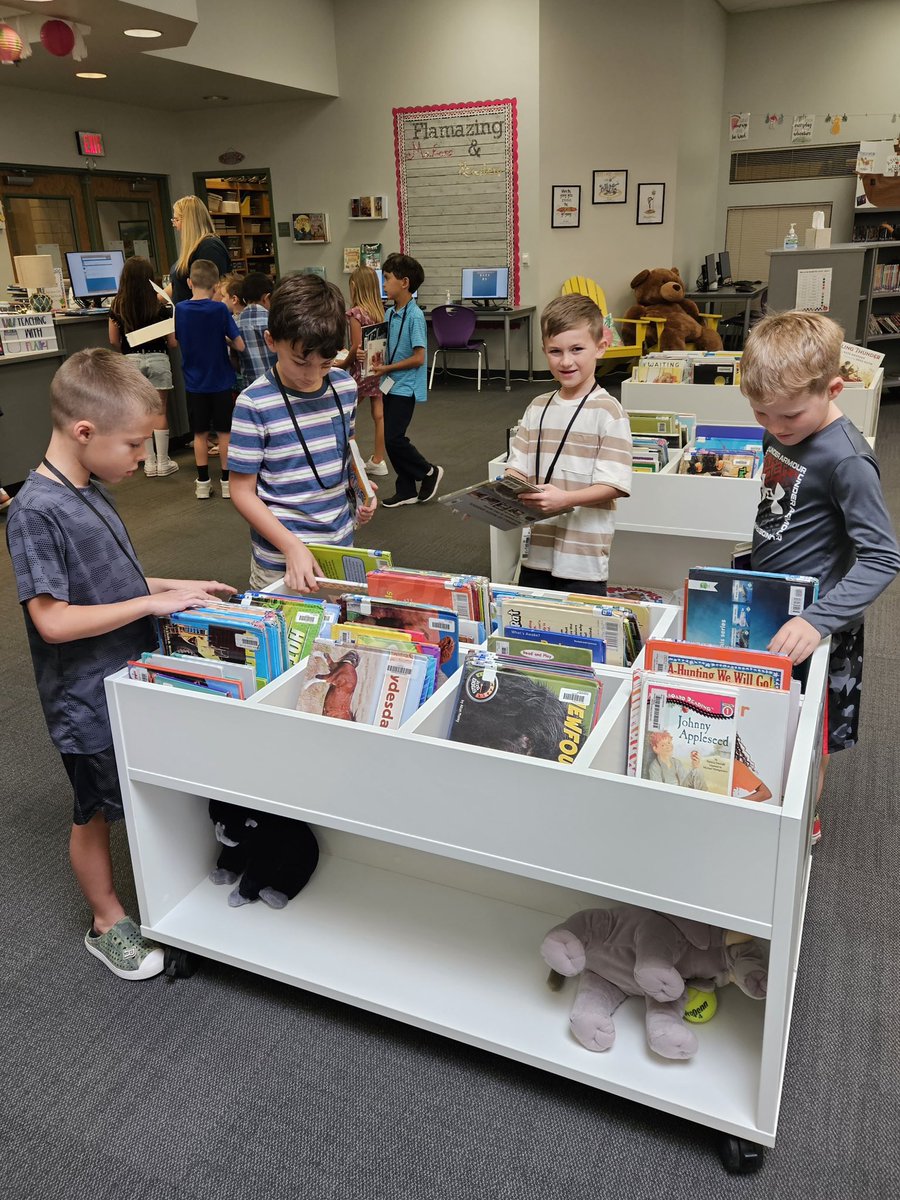 Ashland_Ranch's tweet photo. It's always a good day to read a book! Second graders enjoy browsing for books with friends in Library. #WeAreAshland https://t.co/hFvfuGXQLG