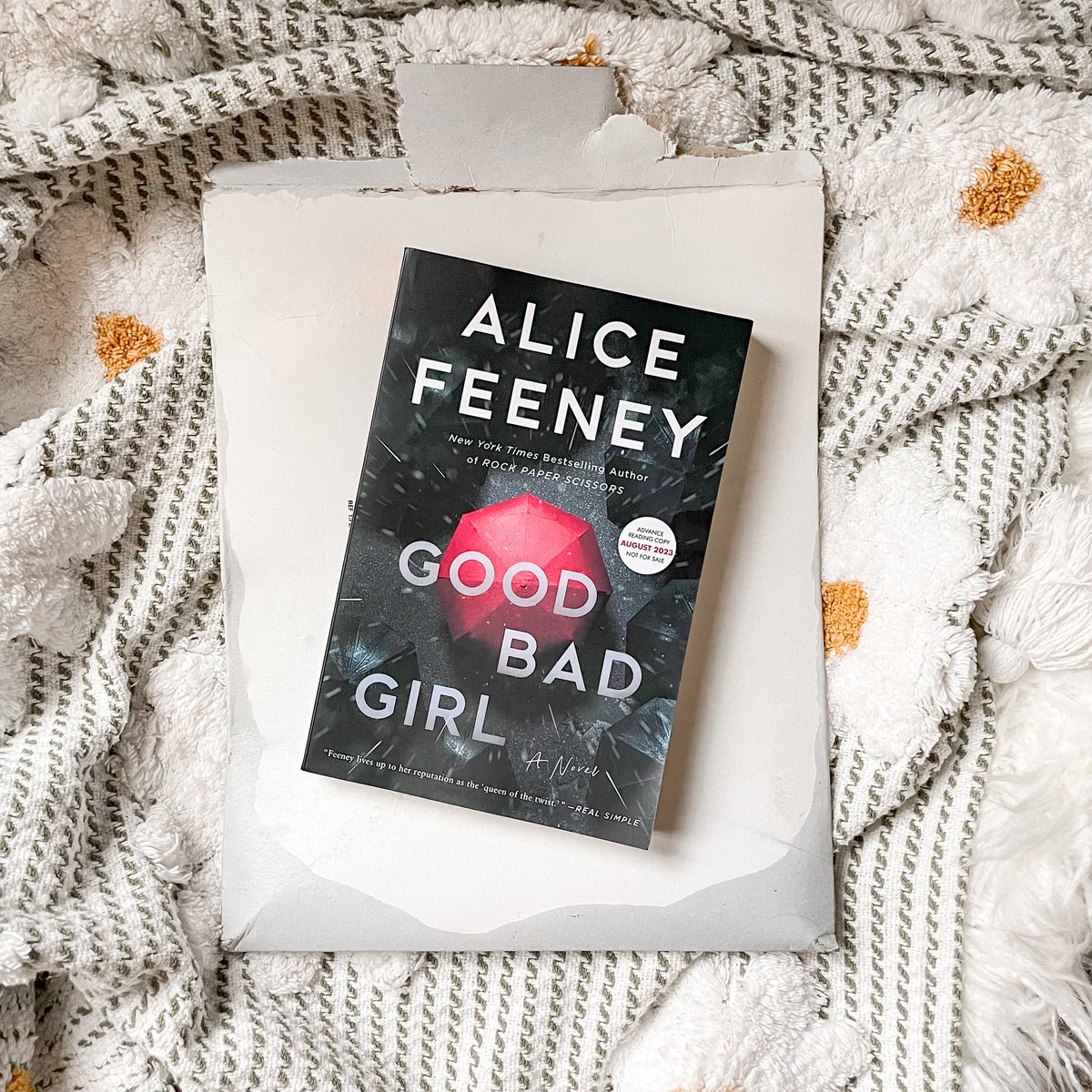 thebookpear's tweet photo. AH! Book mail on my porch getting SOAKED. I have to laugh because life imitates art. ☔️ Thank you so much @Flatironbooks and @alicewriterland!! I am SO excited to read Good Bad Girl! https://t.co/7yXErmTVwC