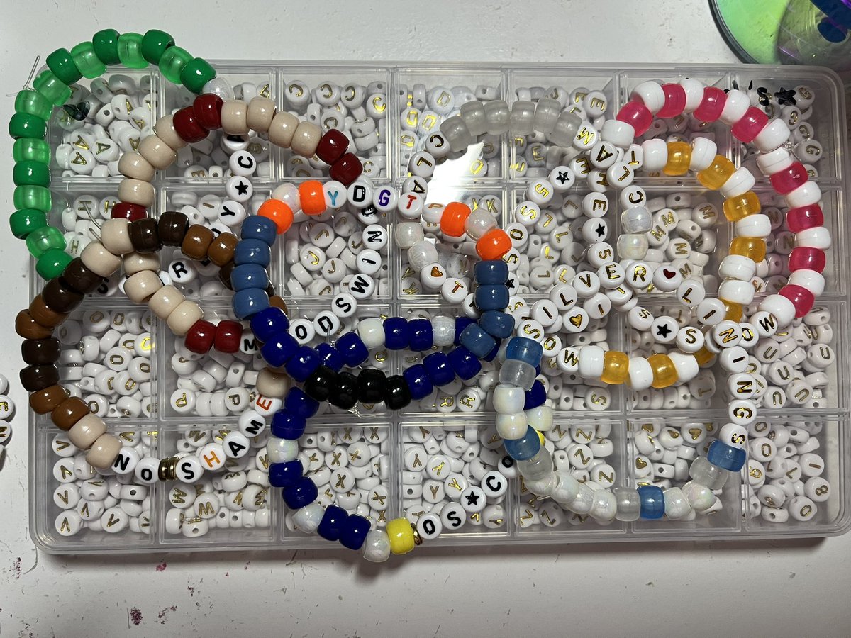 cowboylikelyd's tweet photo. some rlly bad pics of some bracelets i’ve made for the 5sos shows !! (bristow and philly) #5sosbracelets (im at 35 so far) https://t.co/0LJfPlDqts