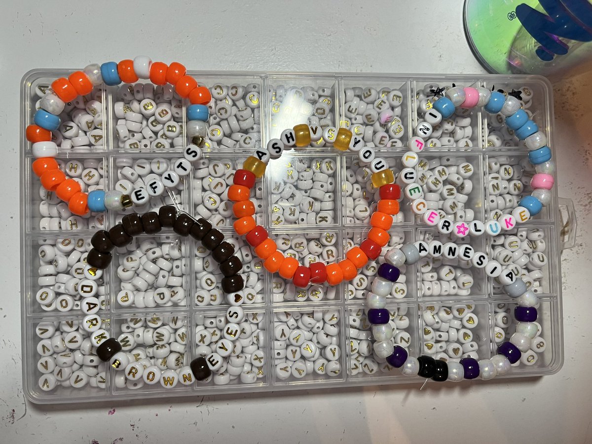 cowboylikelyd's tweet photo. some rlly bad pics of some bracelets i’ve made for the 5sos shows !! (bristow and philly) #5sosbracelets (im at 35 so far) https://t.co/0LJfPlDqts