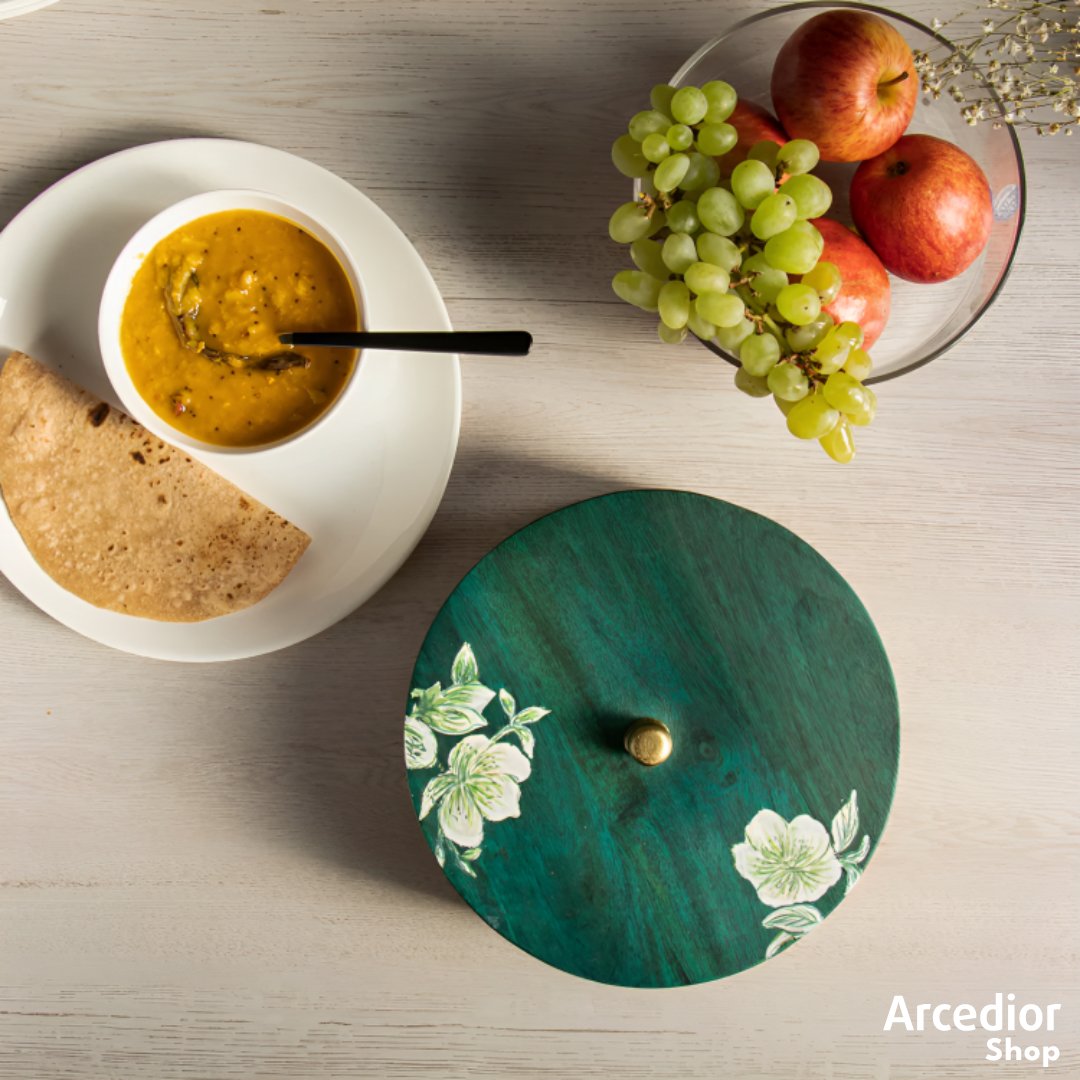 Carnation Roti Box adds warmth to your food with a bit of blossoming aesthetics. Crafted with mango wood stained with teal green, a mold that brings a touch of nature to your space. #MakeInIndia #sustainable