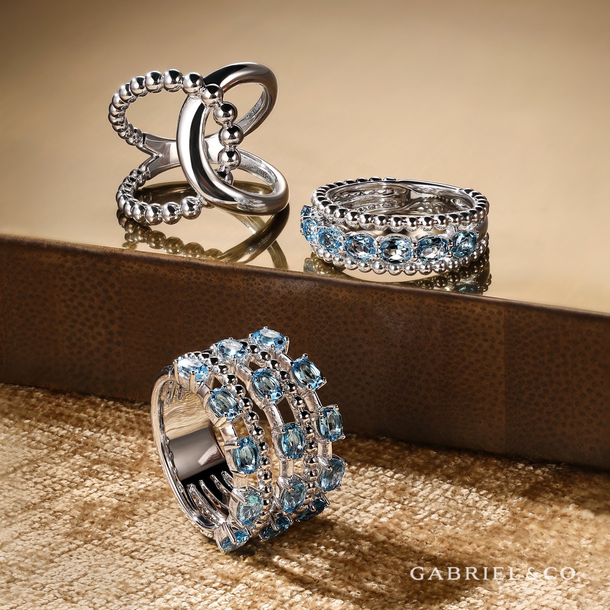 Elevate your summer style with the enchanting allure of our Bujukan Silver rings. The Swiss blue topaz adds a touch of serene beauty. Shop this look at bit.ly/471Opam. #GabrielandCo #silverjewelry #summerjewelry 
Styles: LR52272SVJJJ, LR52331SVJBT & LR52330SVJBT