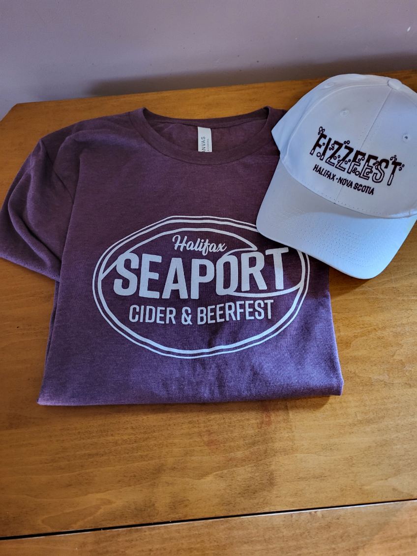 🍻 Merch reveal! 🍻 All sales proceeds of our merch go to <a href="/adsumforwomen/">Adsum for Women & Children</a>.

Unisex BeerFest Event T-Shirt - $25
Limited Edition "Captain Cold One" Unisex T-Shirt - $30
BeerFest Hat - $30
FizzFest Hat - $30
Festival T-Shirt + Hat Combo - $50

Tickets: seaportbeerfest.com