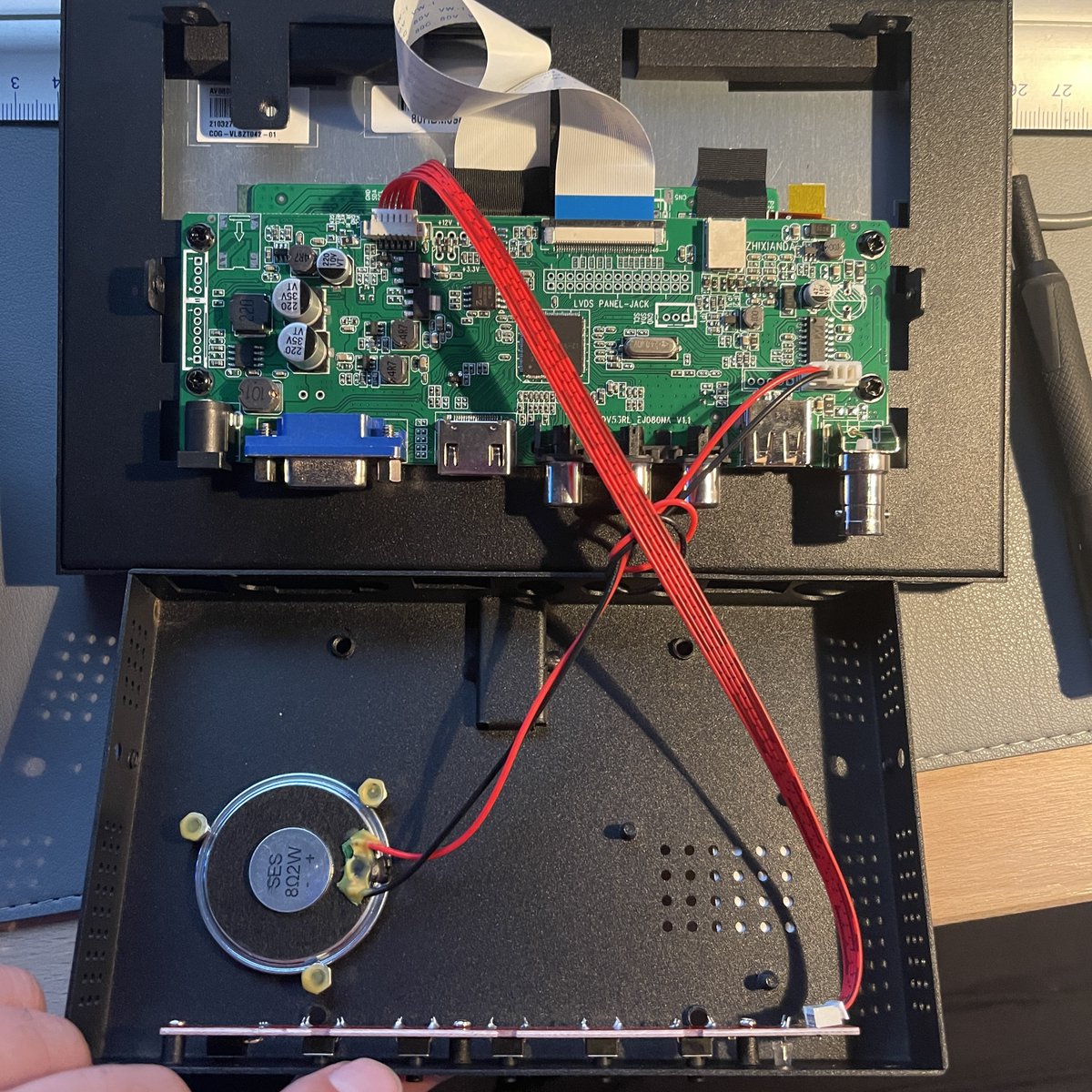 krystman's tweet photo. Audio engineering question. I have this small external display. It has a built-in speaker. I would like a 3.5mm headphone socket instead. Will it work if I just snip off the wires from the speaker and solder them onto the socket? Or will I have a bad time due to ohms/amp issues? https://t.co/TU5T42mFwp