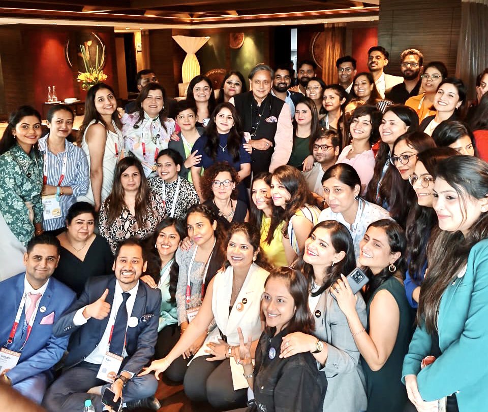 ShashiTharoor's tweet photo. Thoroughly enjoyed a stimulating conversation with Ester Martinez of @PeopleMatters2 at their annual #TechHR conference in Gurgaon. It took place in an overflowing hall, with dozens of people standing in the aisles & the event ran 15 minutes longer than scheduled for, because of the number of questions from the audience. One audience member called me a “human ChatGPT” and I didn’t know whether to be pleased or offended! Will post video when available. (Ended with a group pic with the conference organisers: it IS a woman’s world!)
