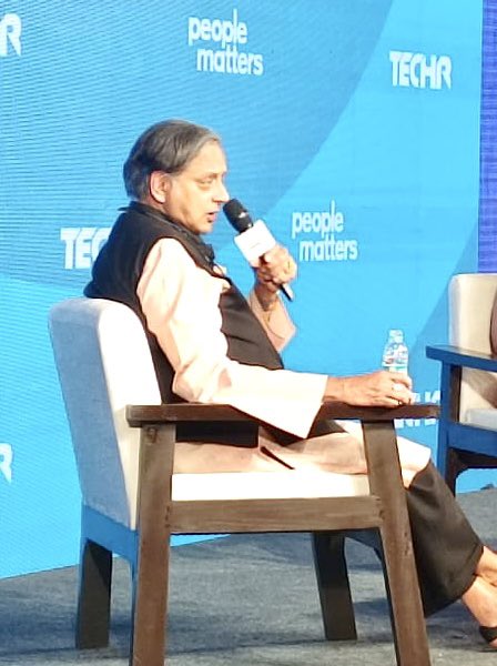 ShashiTharoor's tweet photo. Thoroughly enjoyed a stimulating conversation with Ester Martinez of @PeopleMatters2 at their annual #TechHR conference in Gurgaon. It took place in an overflowing hall, with dozens of people standing in the aisles & the event ran 15 minutes longer than scheduled for, because of the number of questions from the audience. One audience member called me a “human ChatGPT” and I didn’t know whether to be pleased or offended! Will post video when available. (Ended with a group pic with the conference organisers: it IS a woman’s world!)
