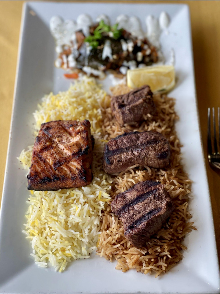 Surf &amp; turf, but Afghan style. Our salmon and beef tenderloin are marinated overnight, charbroiled, then dusted with sumac for a delicious tang that makes your mouth water. This platter includes our roasted eggplant as well as two variations of basmati rice.