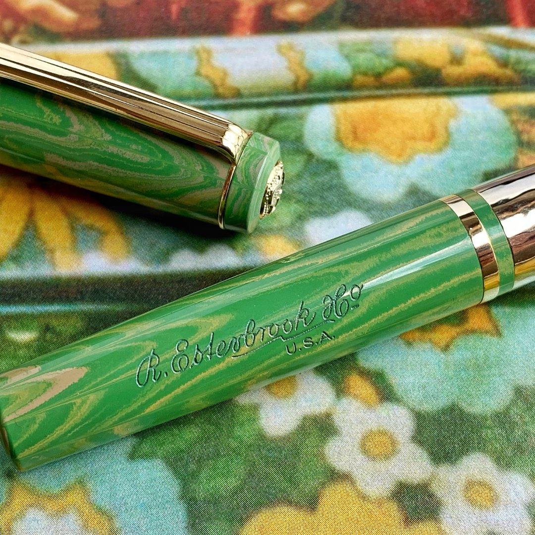 PensStudio's tweet photo. Introducing the Esterbrook Model J - a timeless masterpiece that gracefully blends vintage charm with modern ingenuity. The Model J is made of German ebonite and comes with a Jowo size 6 gold plated nib. Available now in 2 colours - Antique Rose and Lotus Green. https://t.co/O85IeLmved