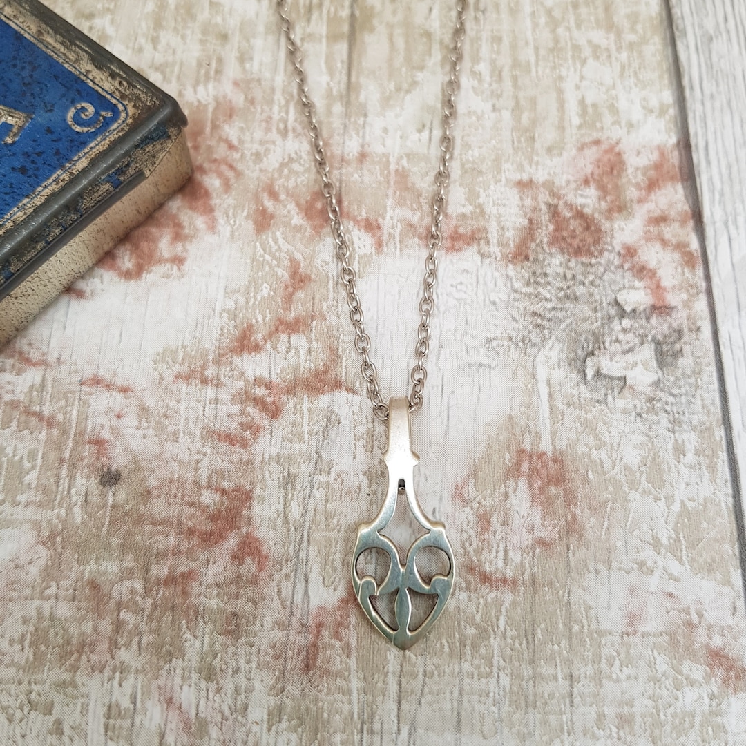 A Celtic  drop necklace  handmade from an ornate spoon end buff.ly/47rW4z8 #SMILEtt23 #spoonjewelry #celticnecklace #silvernecklace #handmadefashion #recycledfashion #uniquejewelry #quirkynecklace