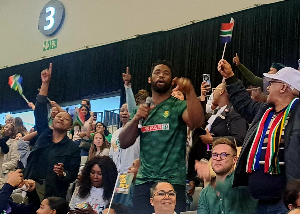 Siya Kolisi leading the singing in the crowd as the Proteas warm up to take on Tonga at the #NetballWorldCup2023