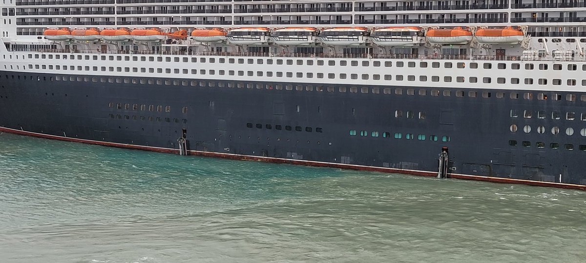 The <a href="/cunardline/">cunardline</a> Queen Mary 2 broke away from its moorings today in #Civitavecchia.  The #QM2 almost hit the <a href="/CruiseNorwegian/">Norwegian Cruise Line</a> "Breakaway" but 3 tugs assisted the ship.  2 of the gangways were left dangling.