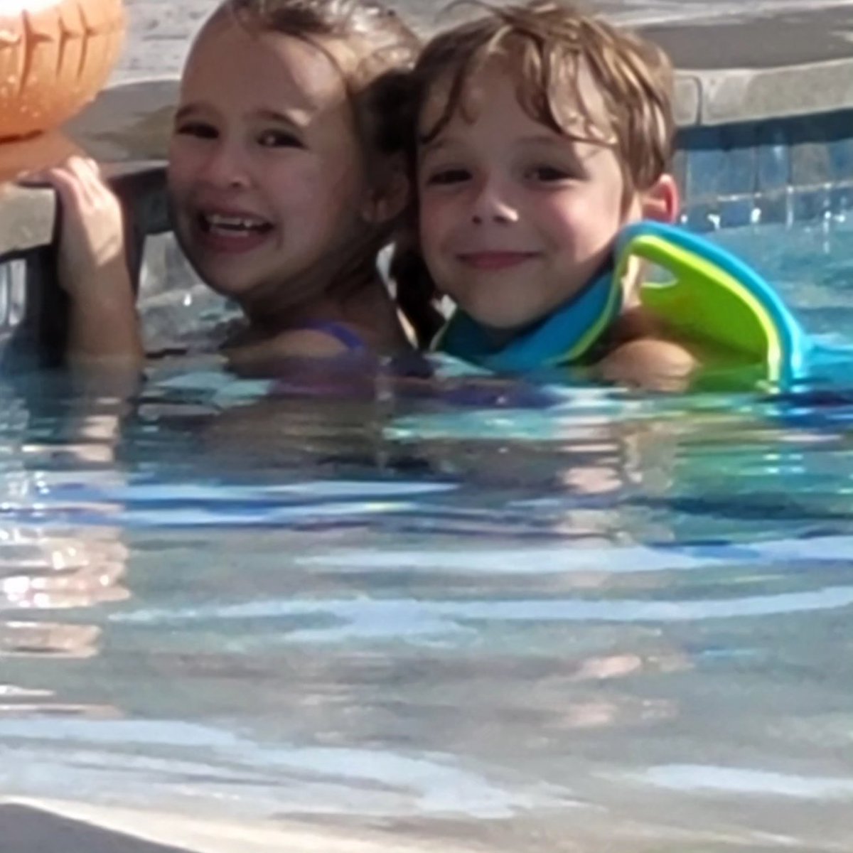 My babies enjoying the pool. Little Miss Diva loves my sunglasses! I haven't gotten a picture of Travis yet.