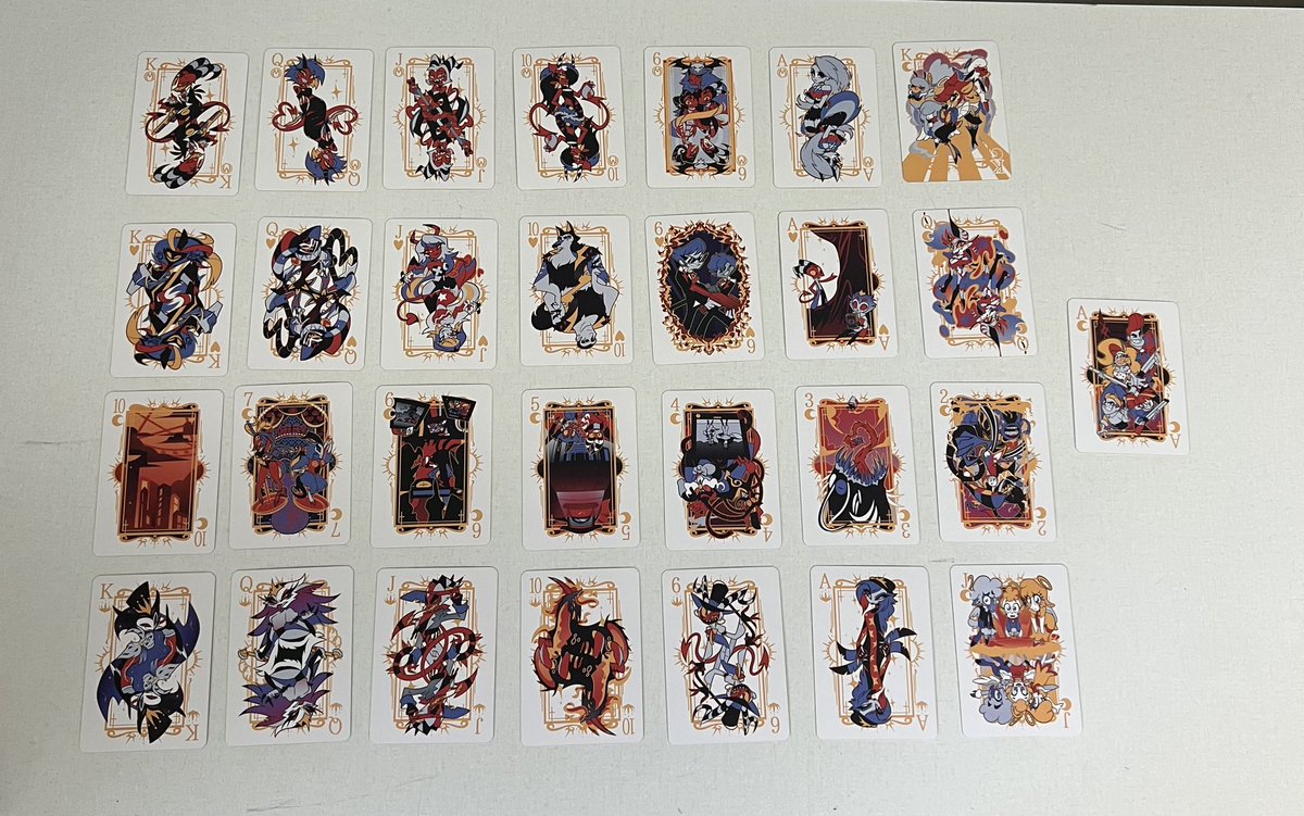 MintLeaf314's tweet photo. @VivziePop &amp; @IMPmurderpros
The cards look great! The gold finish looks outstanding, especially on the sides of the cards! The art is fantastic! I look forward to playing some vigorous solitaire with them 😈 https://t.co/w9OkNK5KkJ