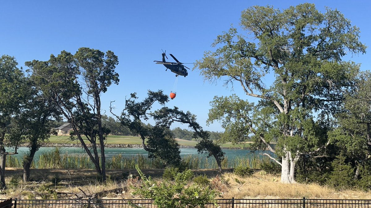 stephhuskin's tweet photo. @News4SA the helicopters filling up to put out the fire over here in Cibolo Canyon off TPC. https://t.co/yJJQuoVDRH