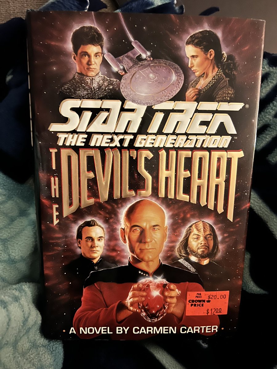 aprilnmarch's tweet image. Cozy on the couch, finished working the Hawks Mock Game at Lumen. Doesn’t everyone cuddle up to a Star Trek book? Just me 😏 #suchanerd