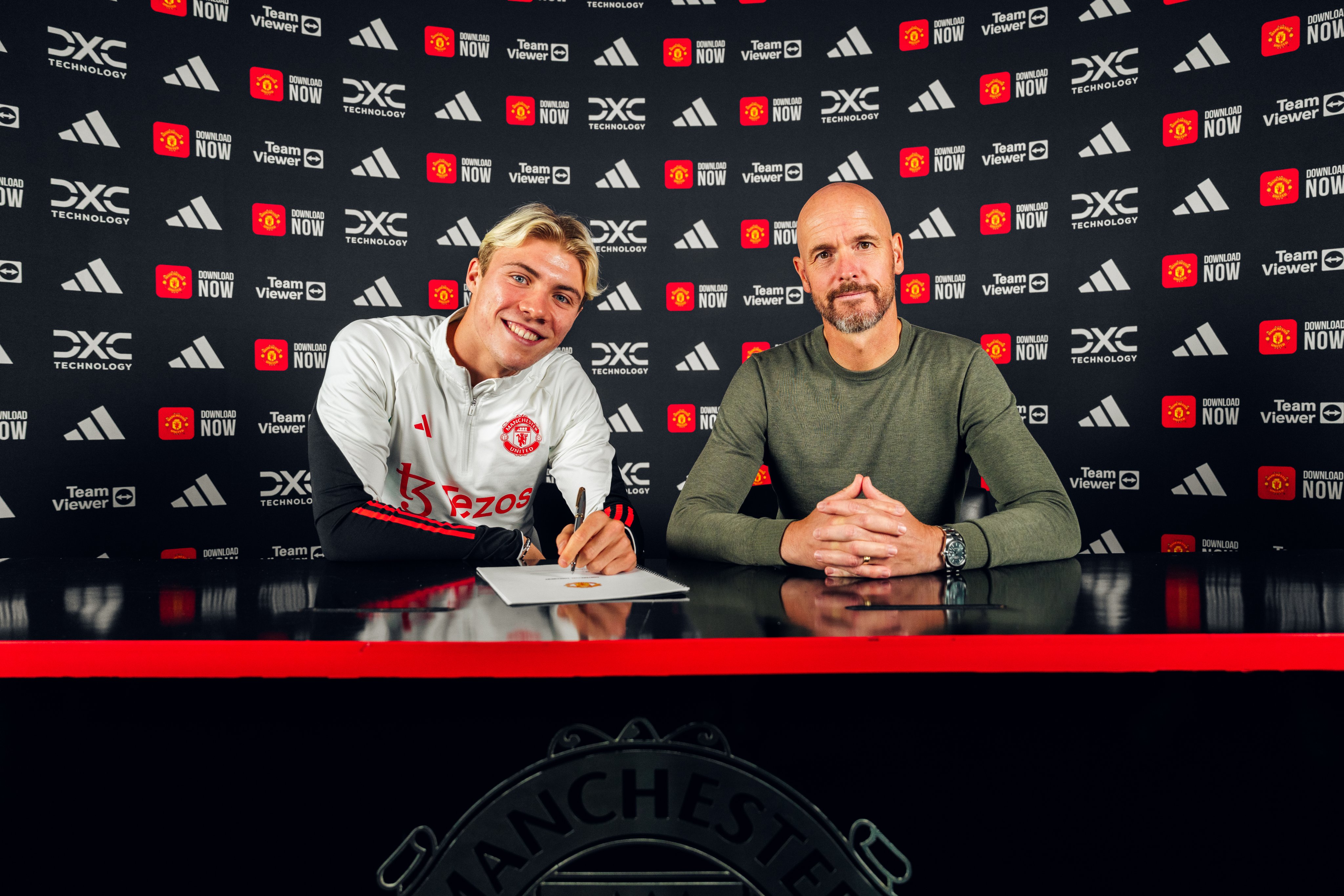 An image of Rasmus Hojlund signing his United contract alongside Erik ten Hag.