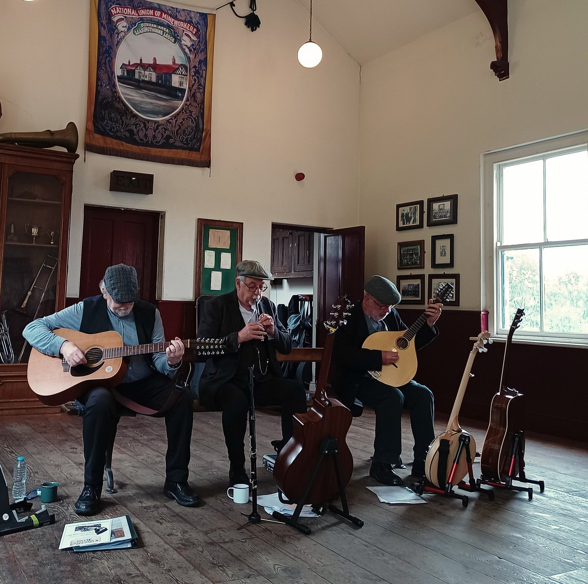 I'm the sole audience member for these guys who are playing old miners' songs and because I'm the only one they've made me a cup of tea 😌