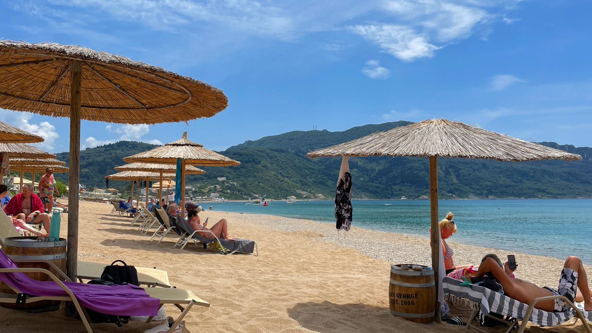 Surrender to the sun-kissed shores of Agios Georgios Beach, Corfu 🏖️🇬🇷 Immerse yourself in the turquoise waters, stroll along the golden sands, and experience pure relaxation in this Greek paradise. #TravelGreece #AgiosGeorgiosBeach #CorfuIsland #BeachVacation #Travel #Corfu
