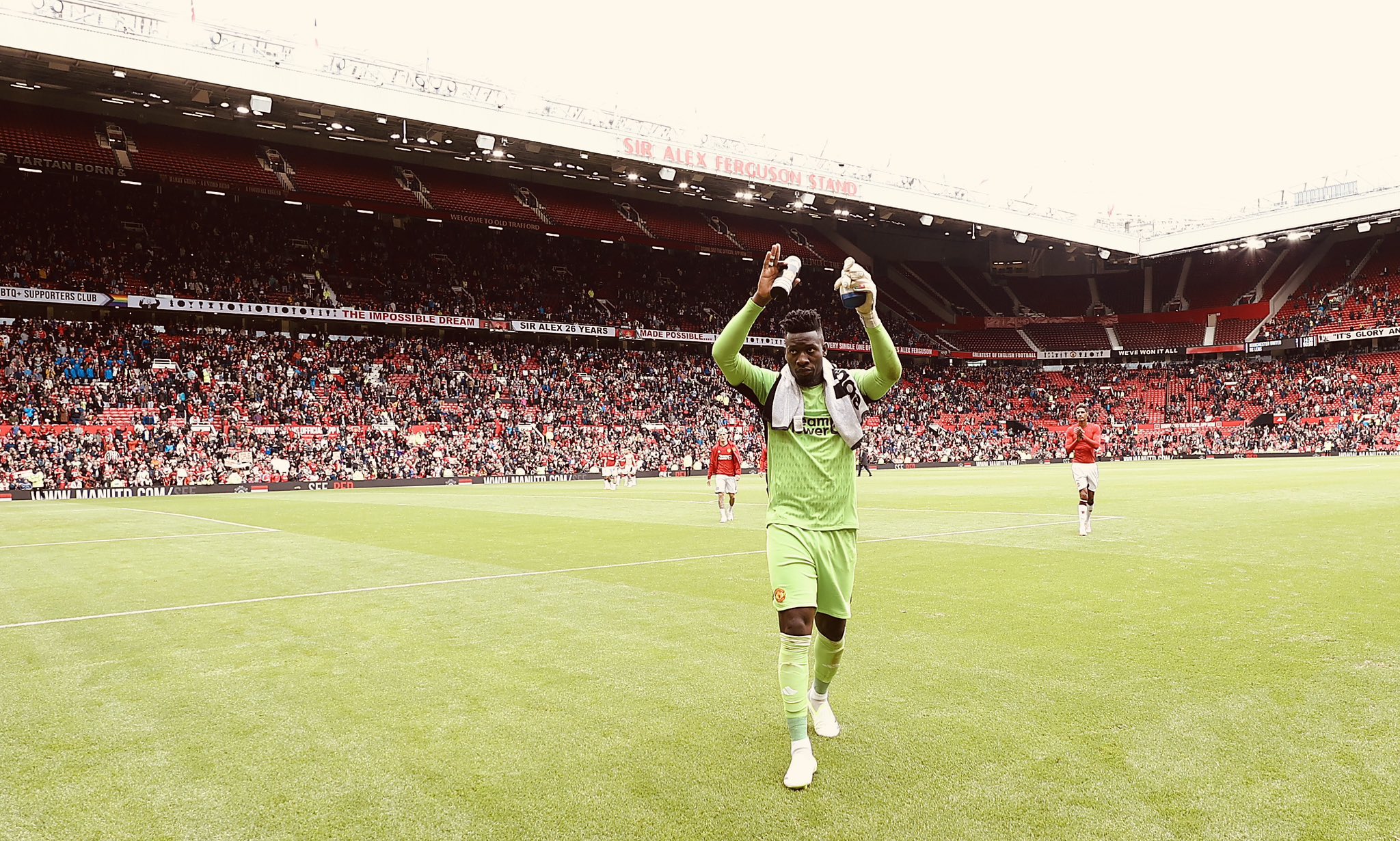 Andre Onana salutes the United fans at full-time.