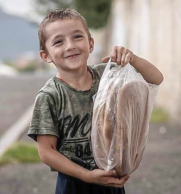 What is happiness for you?

For this boy in blockaded Arsakh it is being able to find some bread.