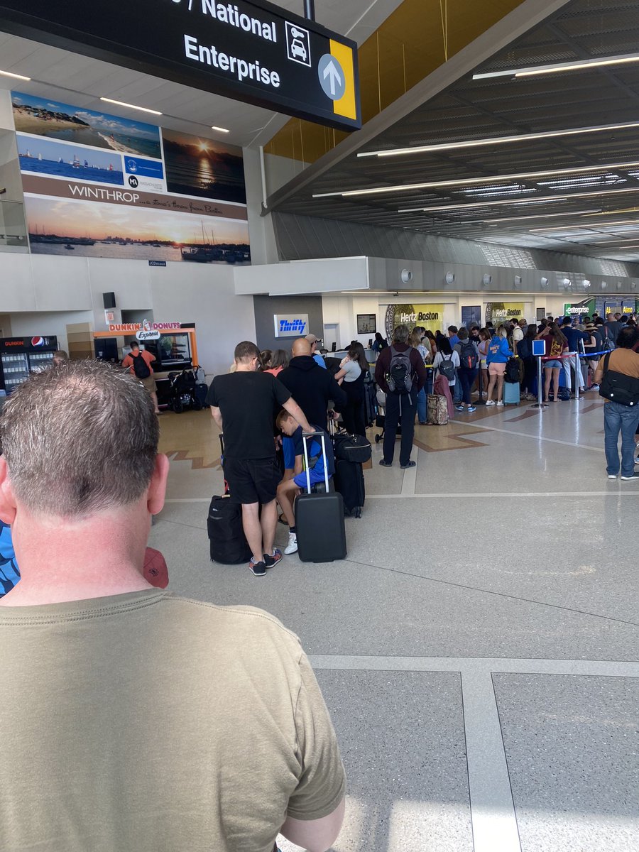 Clare39235261's tweet photo. One hour and twenty minutes in the @thriftycars line at Boston Logan. Maybe half way through. Ridiculous. Three out of six desks open. https://t.co/9zH7xuKpAw