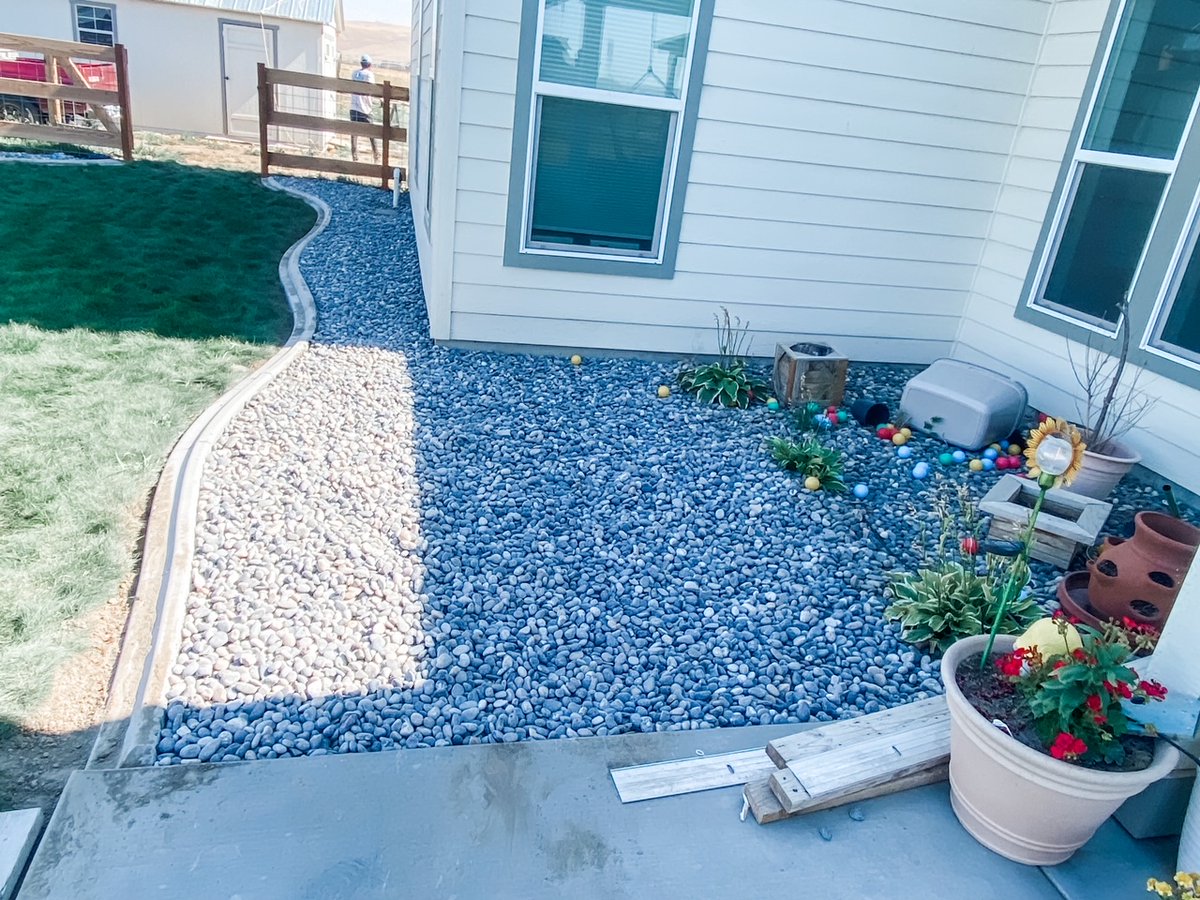 Landscaping.  New concrete curbing borders with some landscape rock to match.  Some sprinkler repair, concrete patio and fence.  Thank you Tri-Cities.