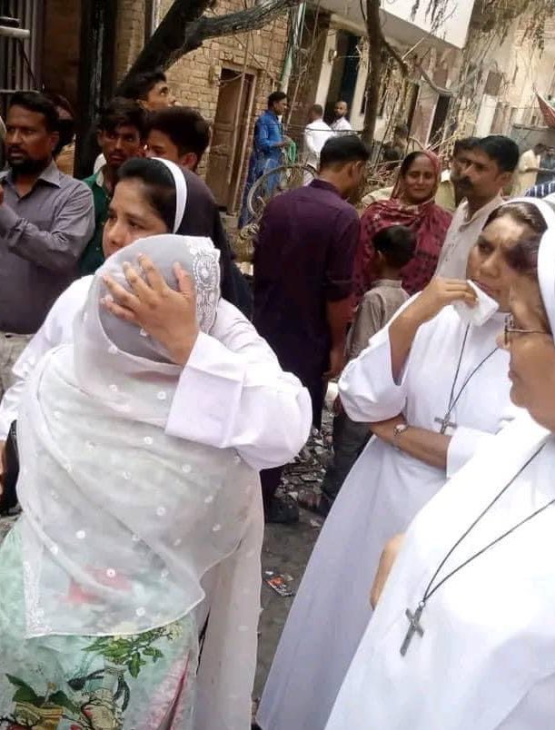 Dominican nuns consoling Christians whose homes and churches have been destroyed by Islamists in Pakistan’s Jaranwala.