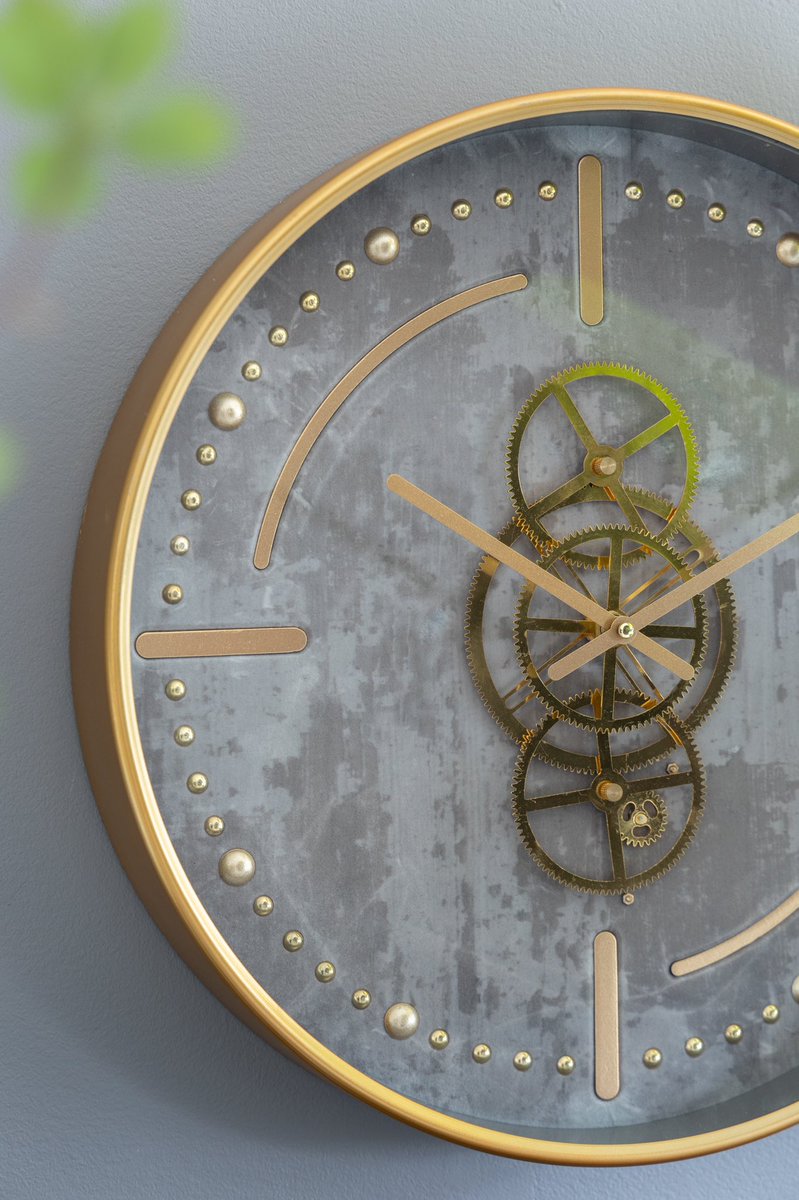 evergreendecor's tweet photo. By replacing traditional numerals with an artistic combination of lines and dots, and displaying elongated hands over intertwining gears, this clock makes for a unique accent to your home decor. https://t.co/lJ9FUa8P42