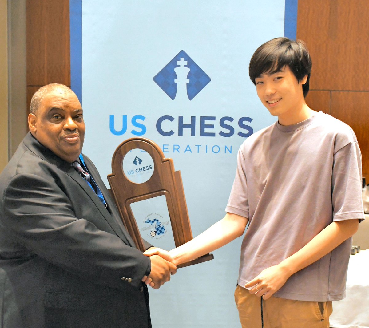 ChessEnterprise's tweet image. Chief Tournament Director Myron Thomas, NTD and Grandmaster Andrew Tang co-champion of the 2023 U.S. Open. Tang won the Armageddon playoff to win the Big Trophy.

The 123rd Annual U.S. Open was held July 29 - August 6, 2023 in Grand Rapids, MI.