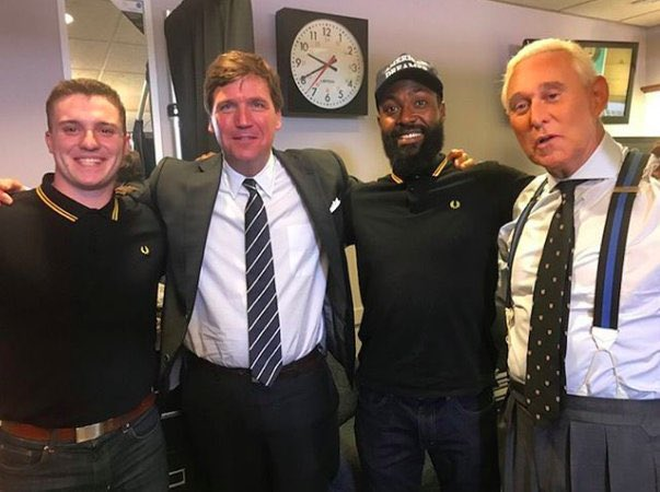 Definitely don't share this photo of Tucker Carlson, Roger Stone, and some members of the Proud Boys - a domestic terrorist trifecta.