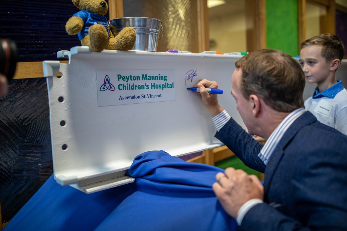 PeytonChildrens's tweet photo. Peyton Manning joined guests in celebrating a milestone of the construction of the new Women and Children’s Tower at Ascension St. Vincent. One of the final beams that will “top” the tower was on display at Peyton Manning Children’s Hospital for signatures ahead of its placement. https://t.co/nQuzbDfTCl