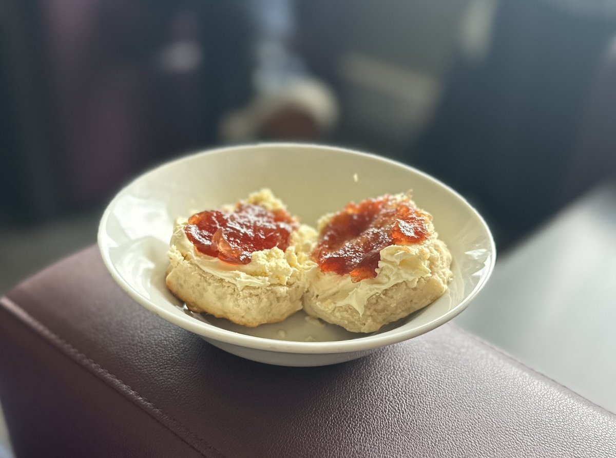 When you flight’s delayed…… but the Aspire lounge has scones with cream and jam. #CreamFirst obviously