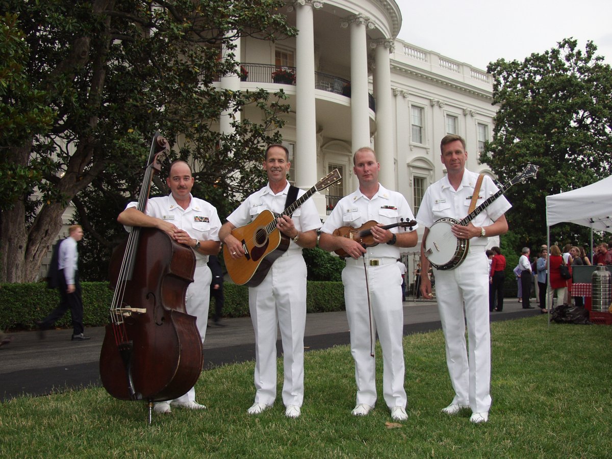 usnavyband's tweet photo. In 1989, Master Chief Bill Emerson formed Country Current’s Bluegrass ensemble featuring acoustic bass, banjo, mandolin, acoustic guitar, and fiddle. The group continues to perform today in a variety of venues including the White House. #USN #USNavy #CountryCurrent #NavyMusic https://t.co/T1SirIbGaK