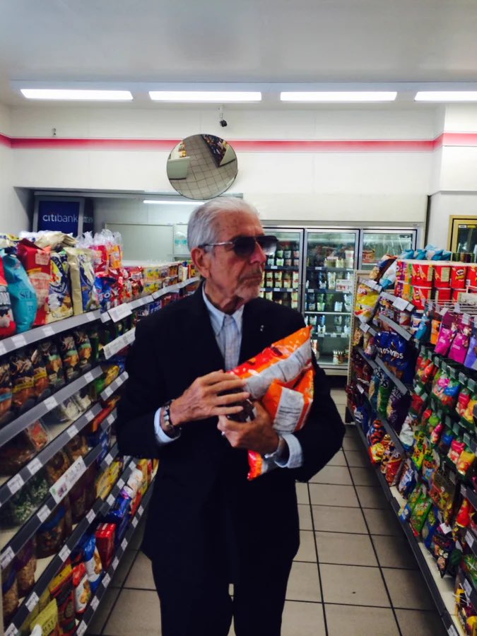 RealEmirHan's tweet photo. Leonard Cohen buying some Cheetos https://t.co/78zdnCzopM