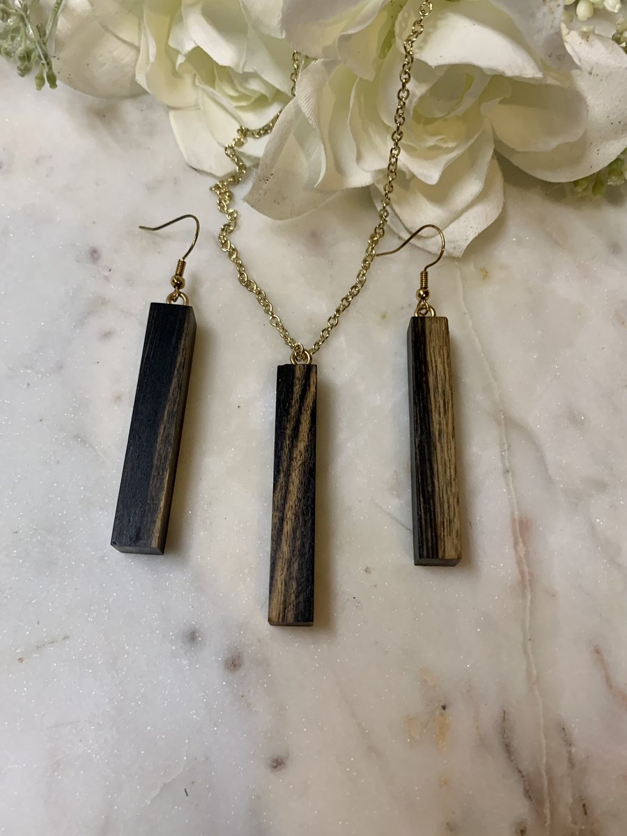 Here is one of our slim style necklaces with a matching pair of our slim style earrings. Black and White Ebony always turns out great! #mcevoymade #woodjewelry #necklaces #blackandwhiteebony