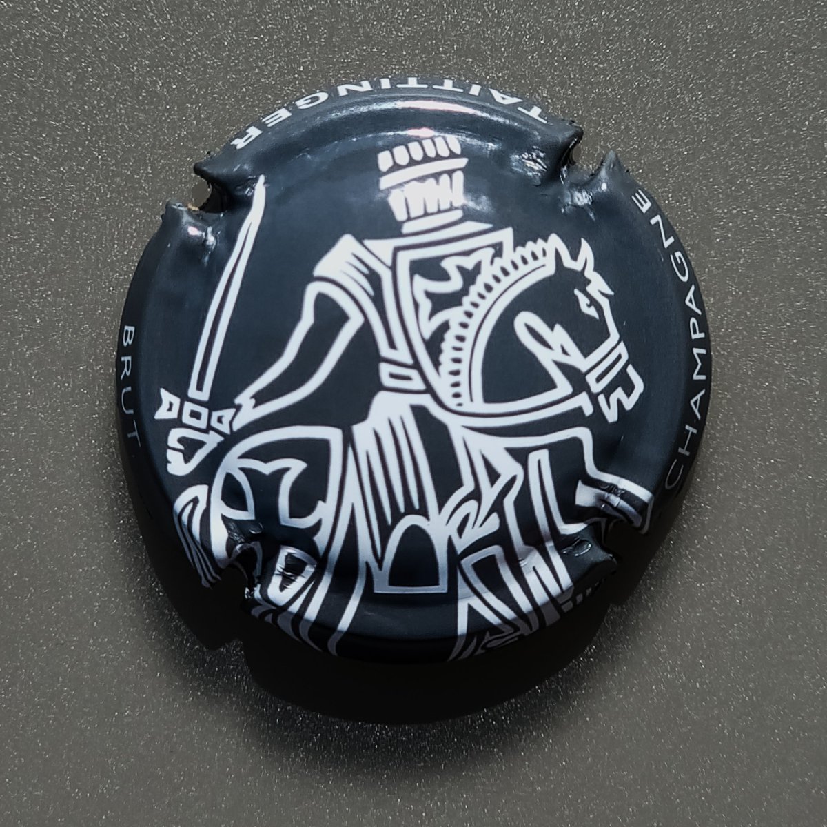 I love the design of this bottle lid. Every bottle features the same lid. If I was responsible for its design, I would vary the lids. #lid #champagne #knight #design #monochrome #photography