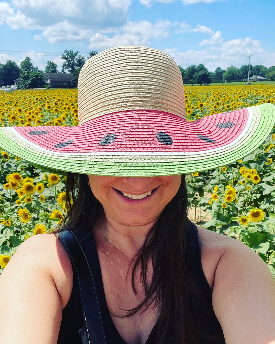 🌻sunflowers🌻 as far as the eye can see and me in a watermelon hat… so typical 
😘

#atypical #actuallyautistic #autisticjoy #sunflowers