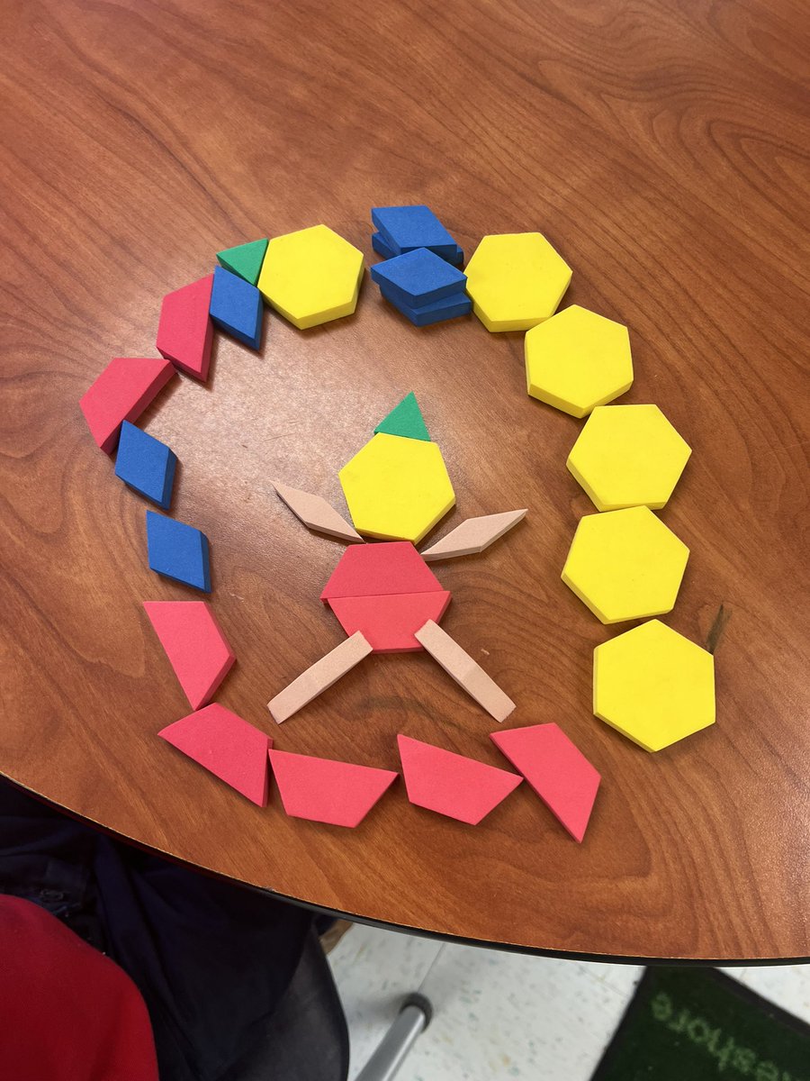 Golden2nd's tweet image. Students are learning all about triangles, quadrilaterals, pentagons, and hexagons. After sorting shapes and naming the number of vertices students created pictures as a collaborative team.  @MaryBAustin ##AimForExcellence #LearningLeading