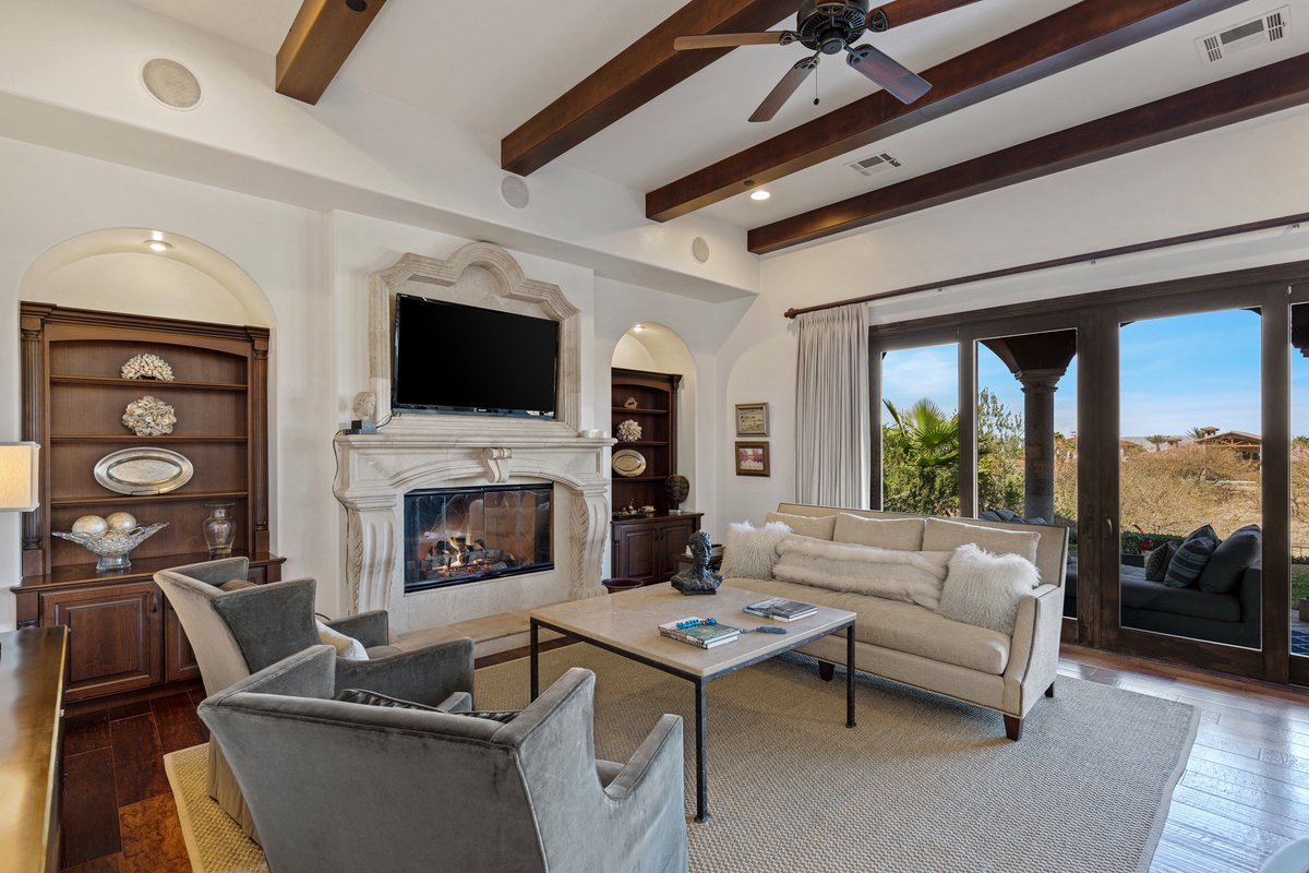 What do you like more—the custom fireplace or the coffered beams? #12RueDuVille • Lake Las Vegas • $3,999,000 7,002 SF • 4 Beds • 6 Baths • Pool & Spa ML#2482287