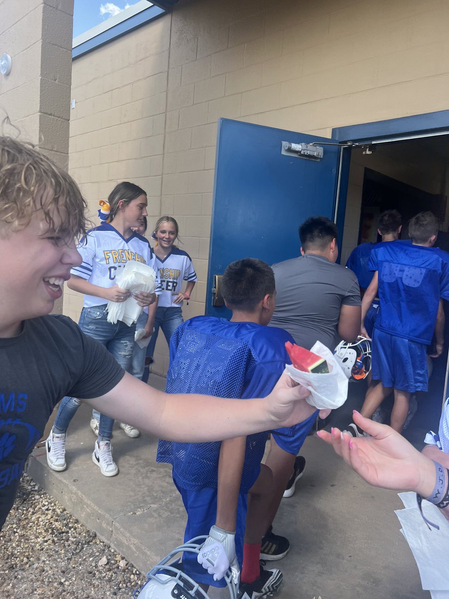 FrenshipMS's tweet photo. What a nice treat on a HOT day!!! The cheerleaders served the 8th grade football boys fresh sliced watermelon! #thefms https://t.co/CT95rQJIvn