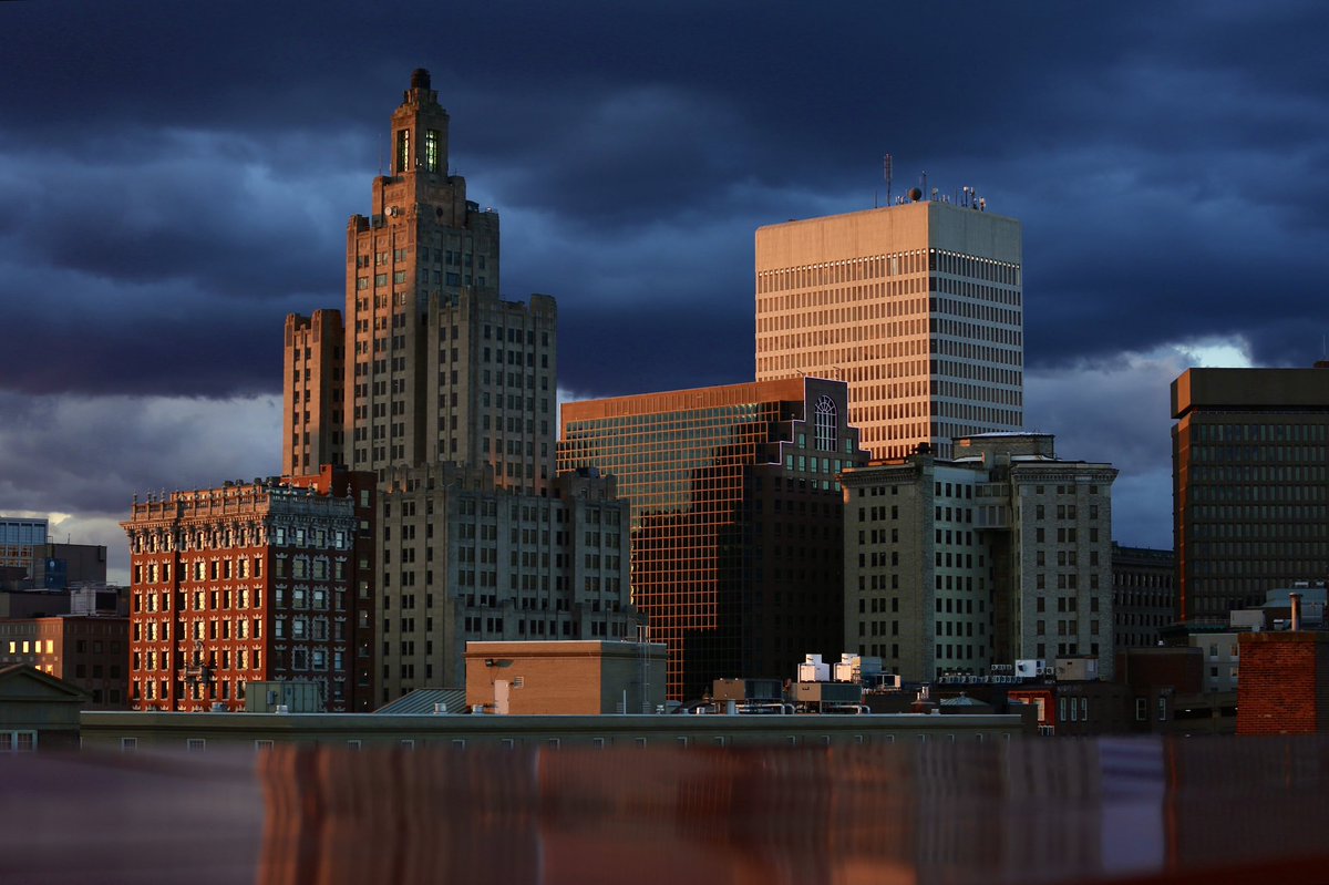 RyanWelchPhotog's tweet image. A setting sun shining on Providence as the dark clouds remain in the background, after a wild day of weather for the state!