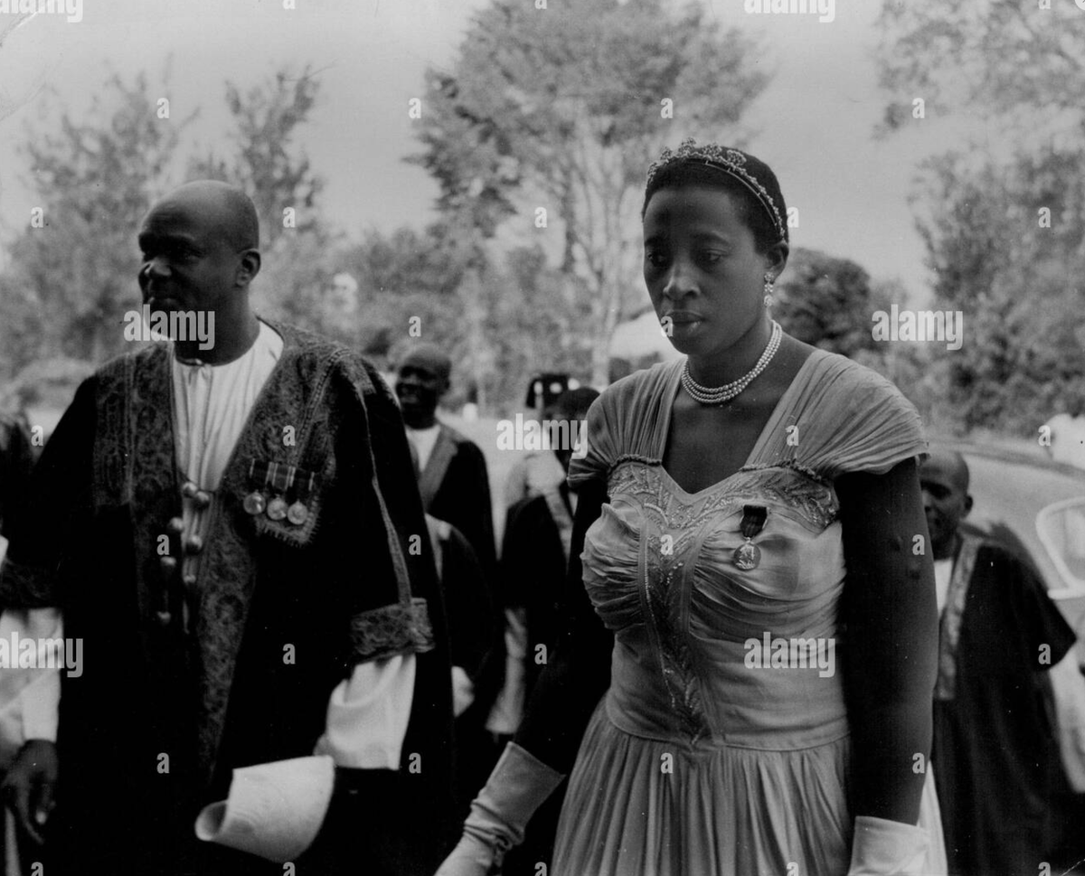 JonathonLEarle's tweet photo. This image was taken on 26 July 1954. It is of the Omukama of Tooro Rukirabasaija Sir George David Matthew Kamurasi Rukidi III and, I believe, Kezia Byanjeru Rukidi Abwooli? Do I have her name correctly? Her countenance and gaze in this image are captivating. https://t.co/lxUT5HNDkV