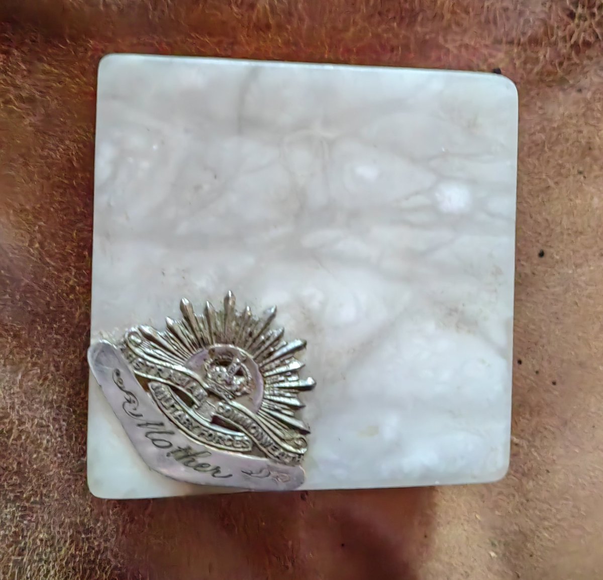 gailymalone's tweet photo. My Nan had 3 sons fight in WWII all she got to show for it was this brooch ... I stuck in on a box. Many other baby boomers Nans sent more. Not really all she got, she also got 4 men in the home with PTSD with attendant alcohol issues self medicating. Lest we forget.

#auspol https://t.co/epKmdjdRwr
