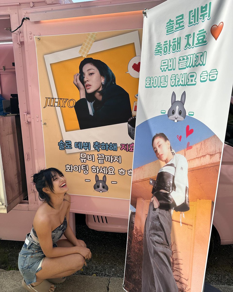 pinkot9's tweet photo. Nayeon sent a food truck to support Jihyo's solo debut. The banner says:

"Congratulations on your solo debut Jihyo 🧡 Keep your spirit up till the very end of MV (shooting)" 
- 🐰 - https://t.co/TwmyyQMvOk