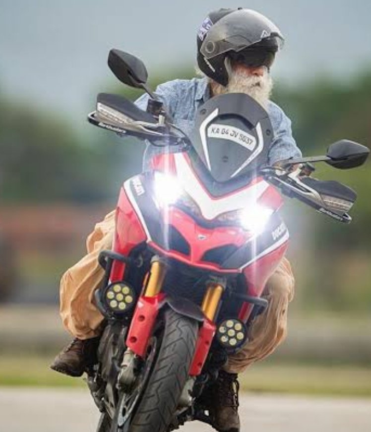 SaffronSunanda's tweet photo. If riding a bike in old age is a qualification to become PM, then Sadhguru is a better PM candidate than Rahul Gandhi. https://t.co/a15AKmP6IJ