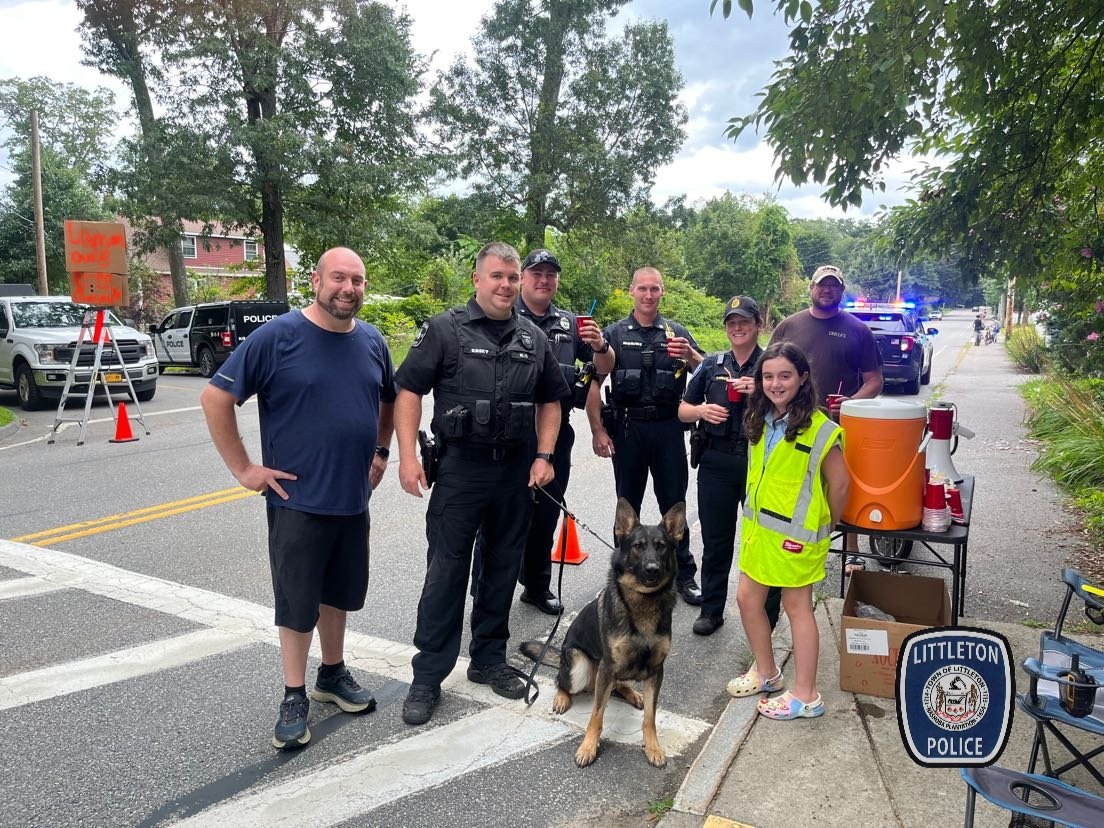 Follow K9 Milo's lead... it's time for some thirst-quenching. Day shift stopped by to support this young entrepreneur at Goldsmith and Lincoln Dr . #LittletonMAPolice #CommunityPolicing. #lemonadeStand