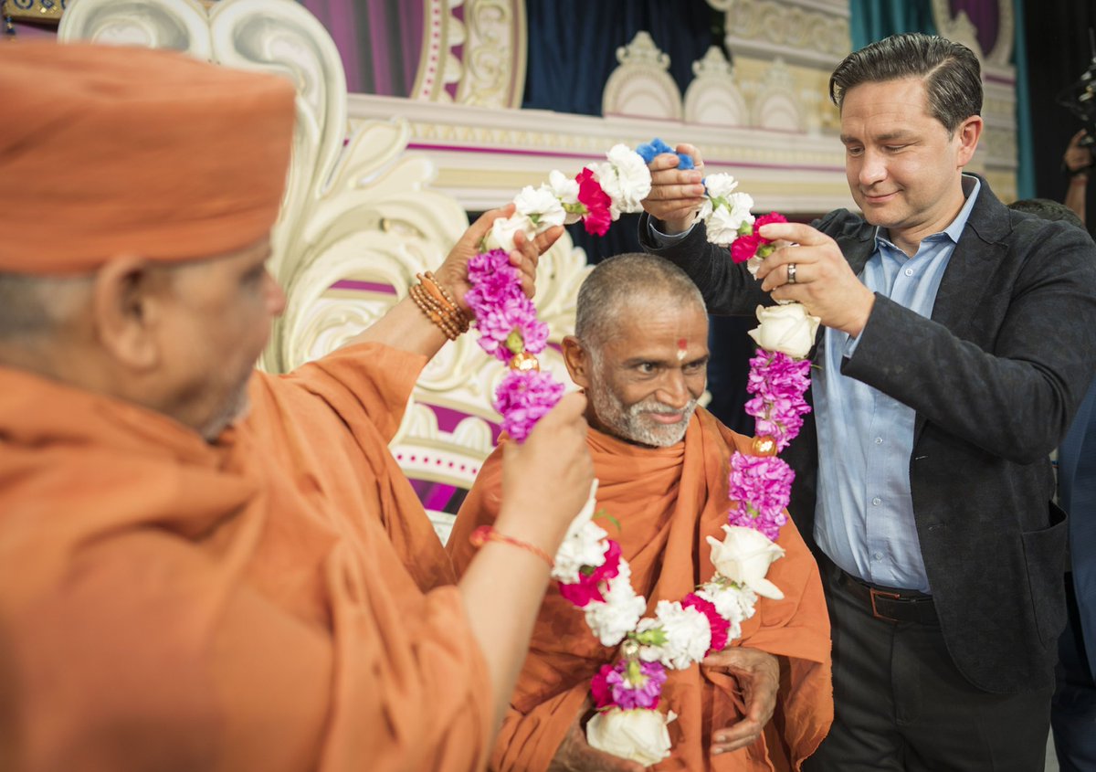 PierrePoilievre's tweet photo. Celebrated faith, family and freedom with His Divine Holiness Prabodh Swamiji Maharaj at the Haridham Yogi Divine Society of Canada temple in Mississauga today. https://t.co/t6xHk0k4m0