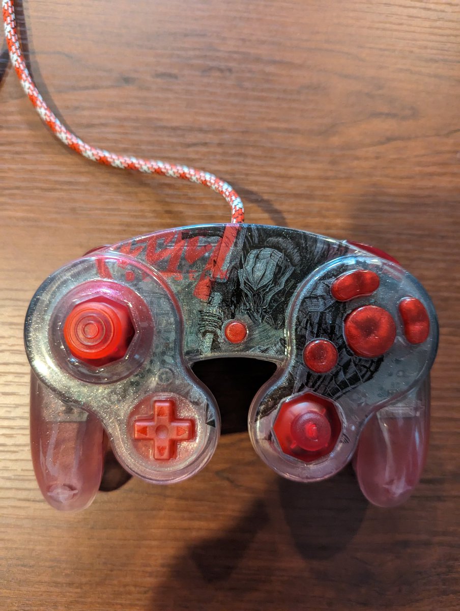 MangaGate's tweet photo. Thank you to @littleteafox for the wonderful berserk themed GameCube controller, loving it! @SmashproofGC for the triggers and sticks. As well as I believe  @NoJonsMods for the buttons and cable. Also a shout-out to my best friend @mistermoogle89 for putting it all together. https://t.co/jtFqwTFoLg